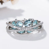 Ring with cross in silver and blue gemstone
